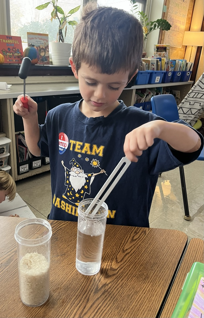 student experiments with a tuning fork