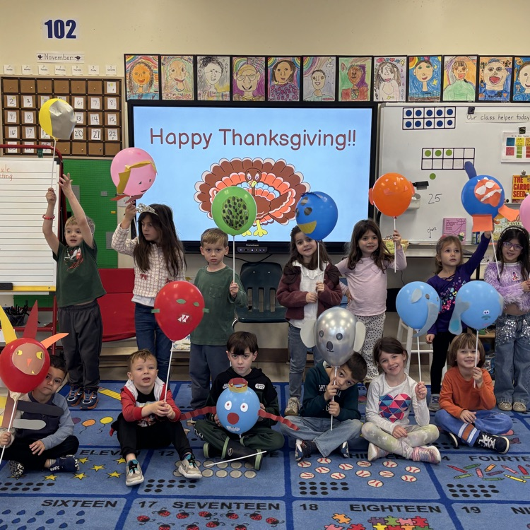 Children carrying balloons