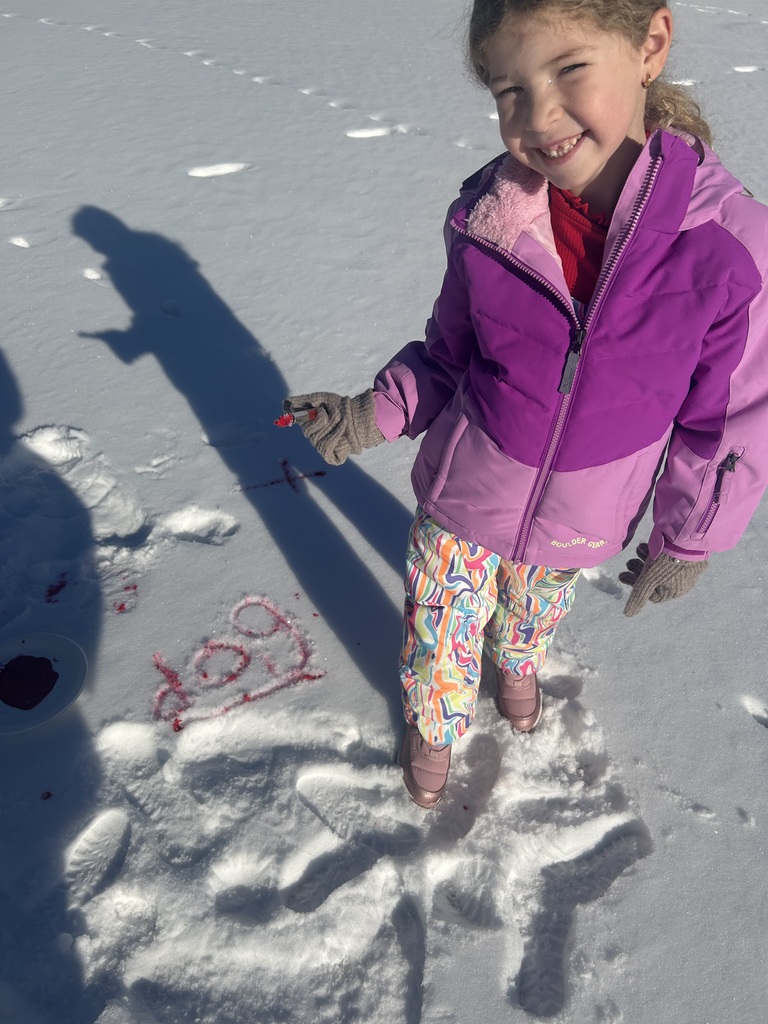 children  writing in the snow