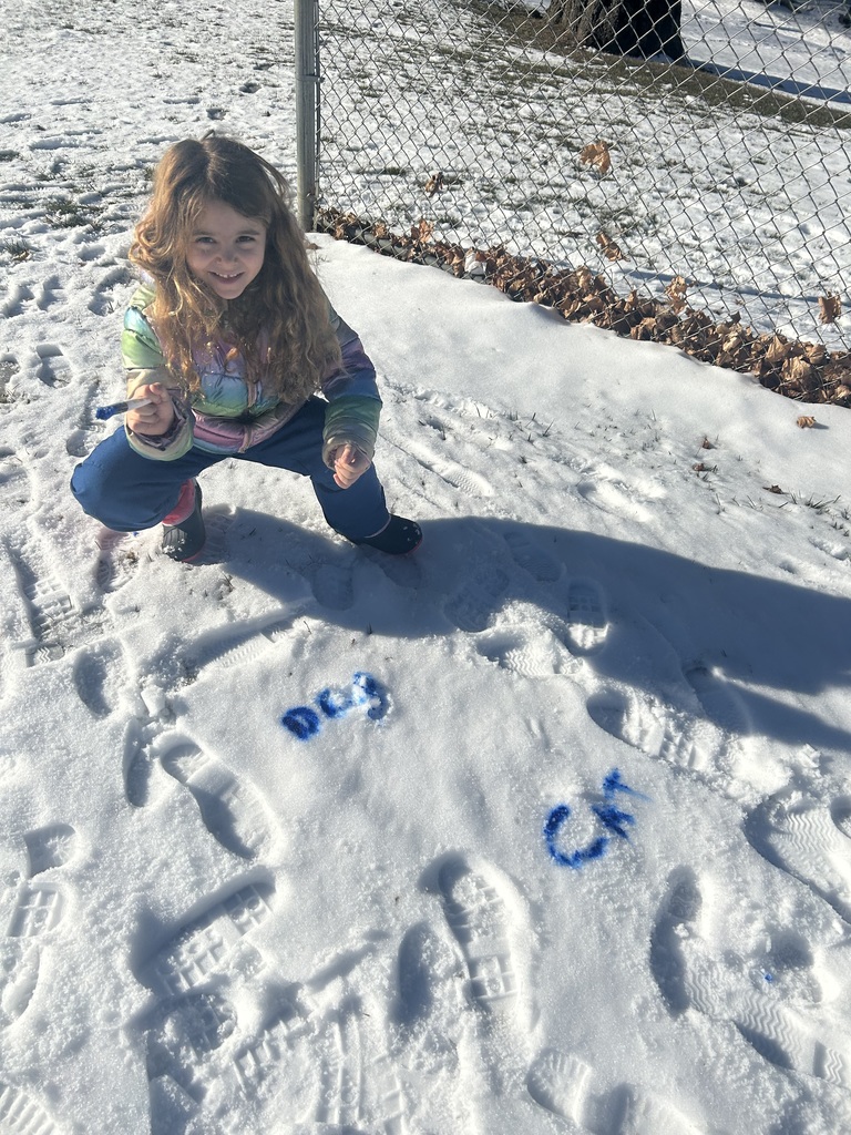 children  writing in the snow