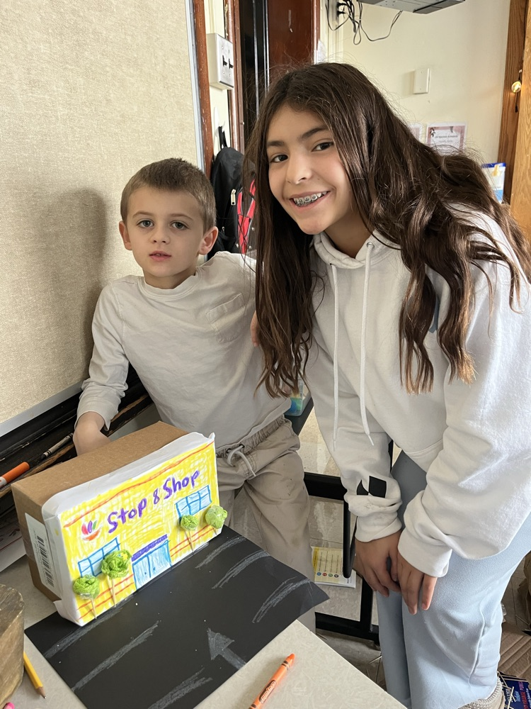 2 children with a model the created of stop and shop