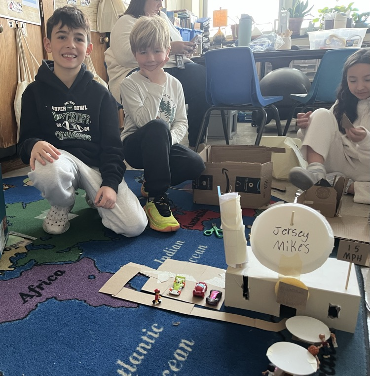 2 children with a model the created of Jersey Mike’s