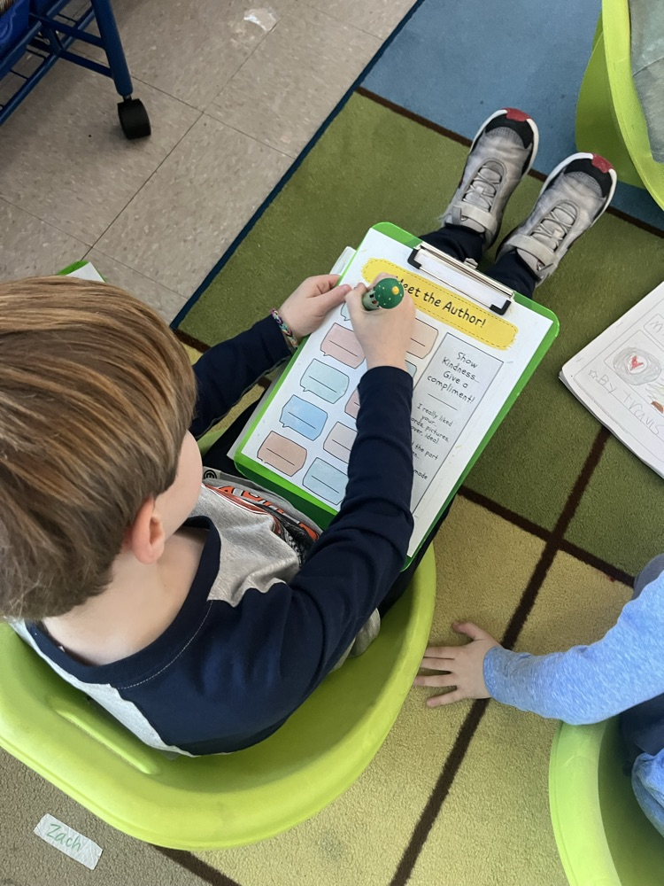 a student writing with a clipboard