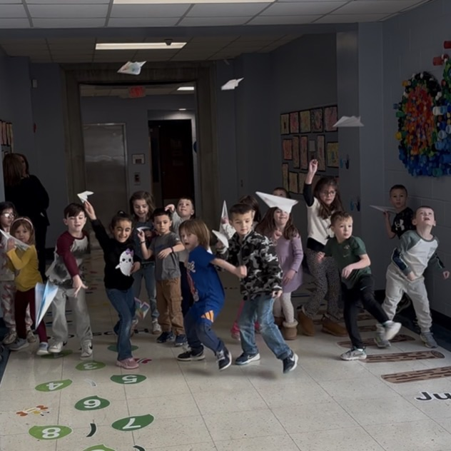 children applying paper airplanes