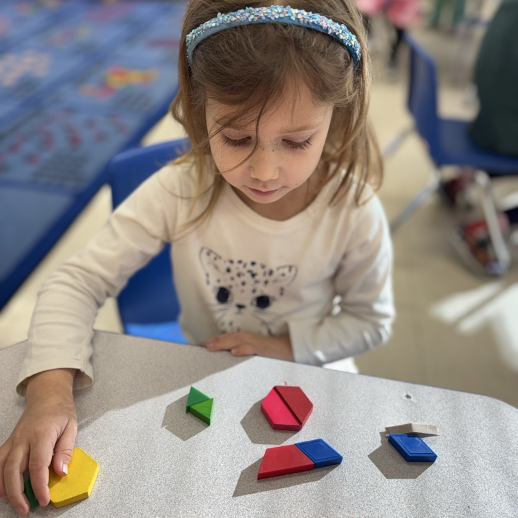 girl playing with shapes