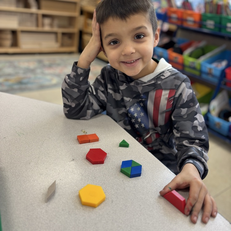 boy playing with shapes and