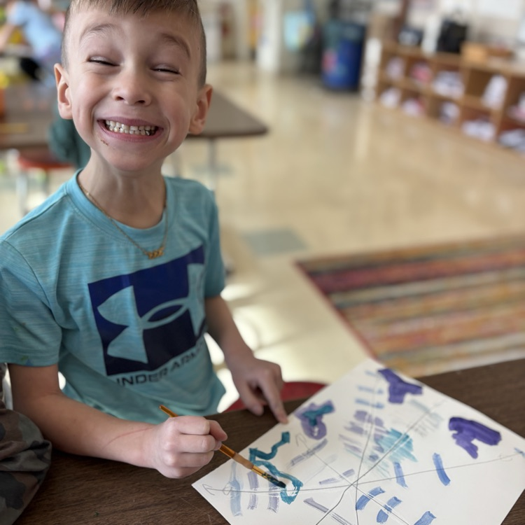 boy, smiling while being snowflake