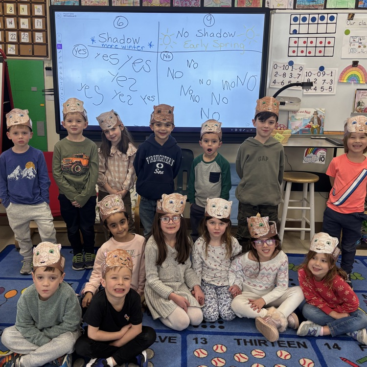 children with groundhog hats on