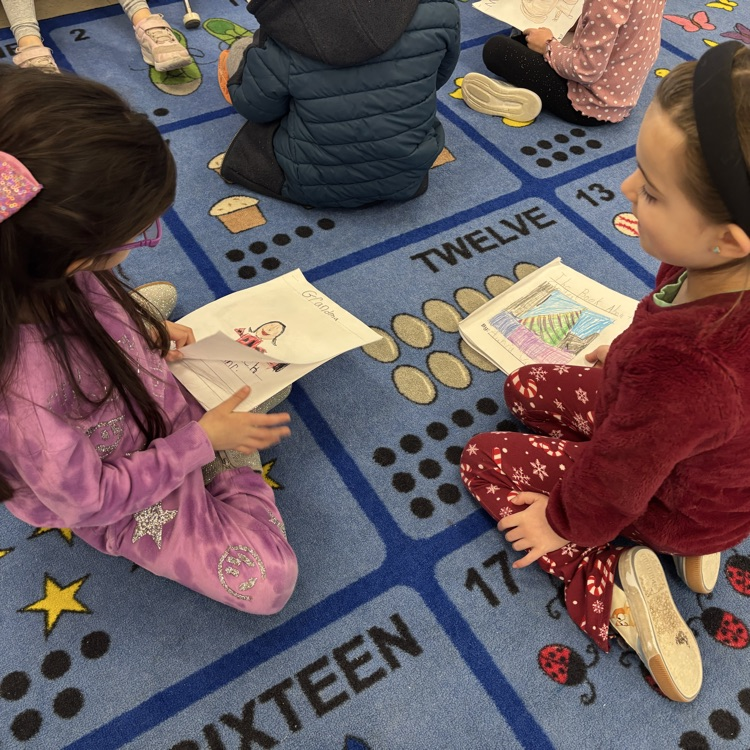 girls reading to one another