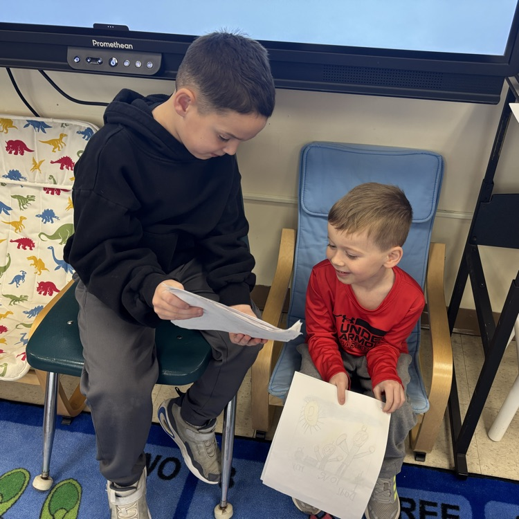 boys reading to one another