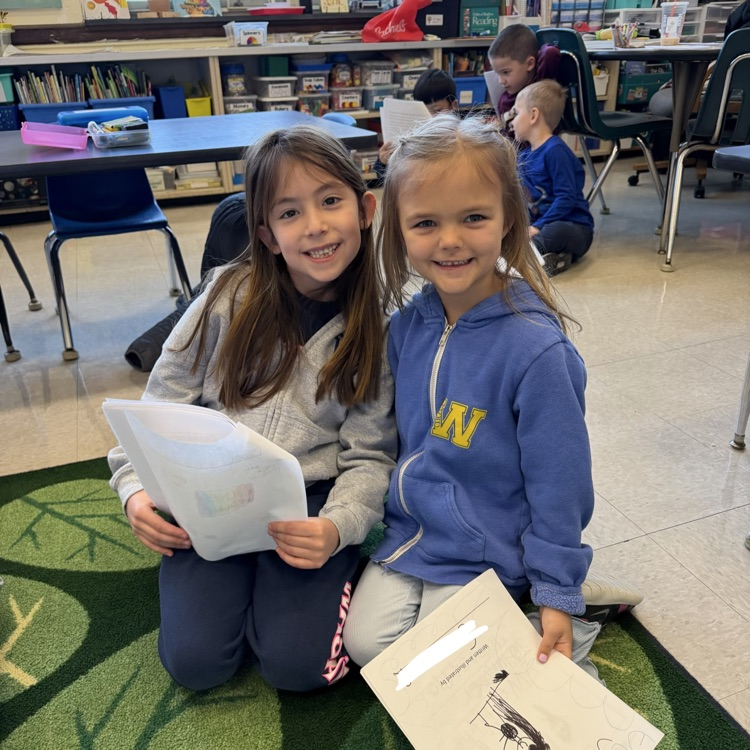 children reading to each other 