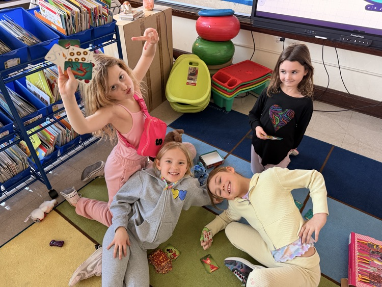 four students playing together