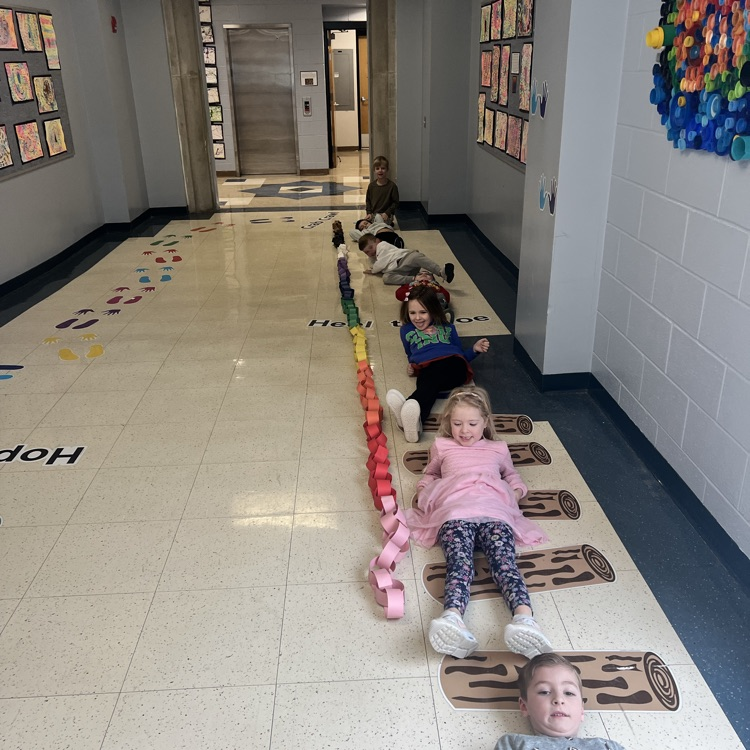 KRO made a 100 chain link for the 100th day of school and measured how long it was compared to the length of the students in our class
