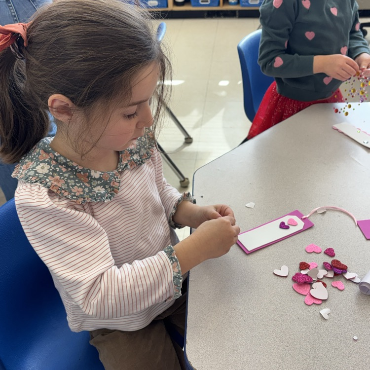 Little girl making Valentine