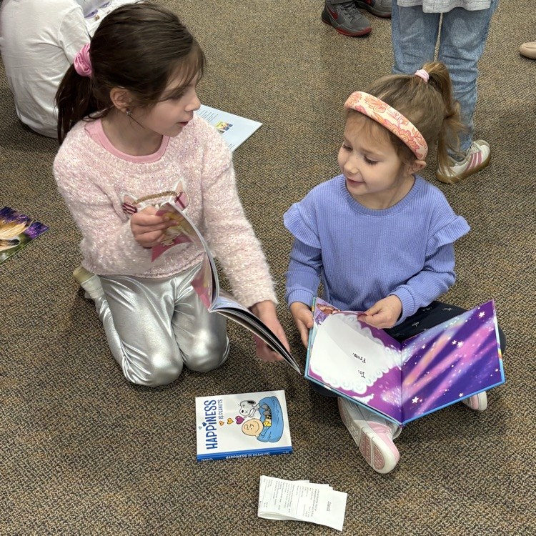 girls looking at book