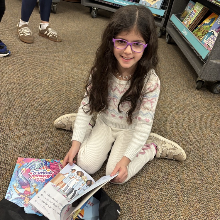 girl, looking at book
