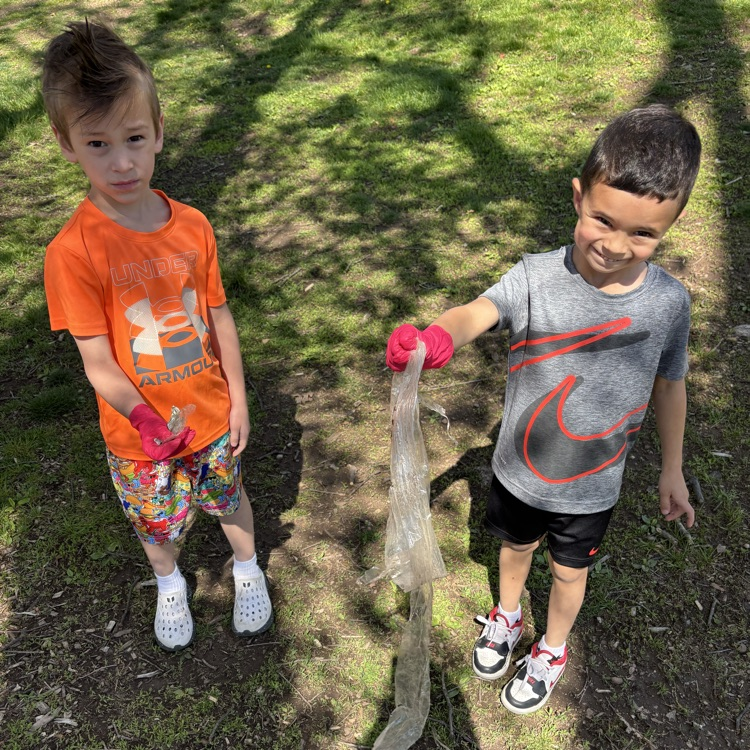 boys picking up garbage