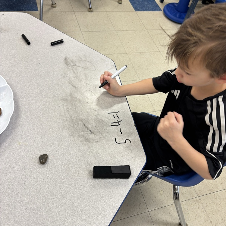 boy, doing a math problem