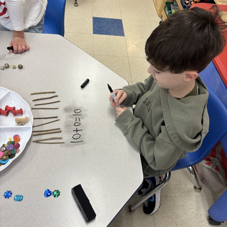 boy, doing a math problem