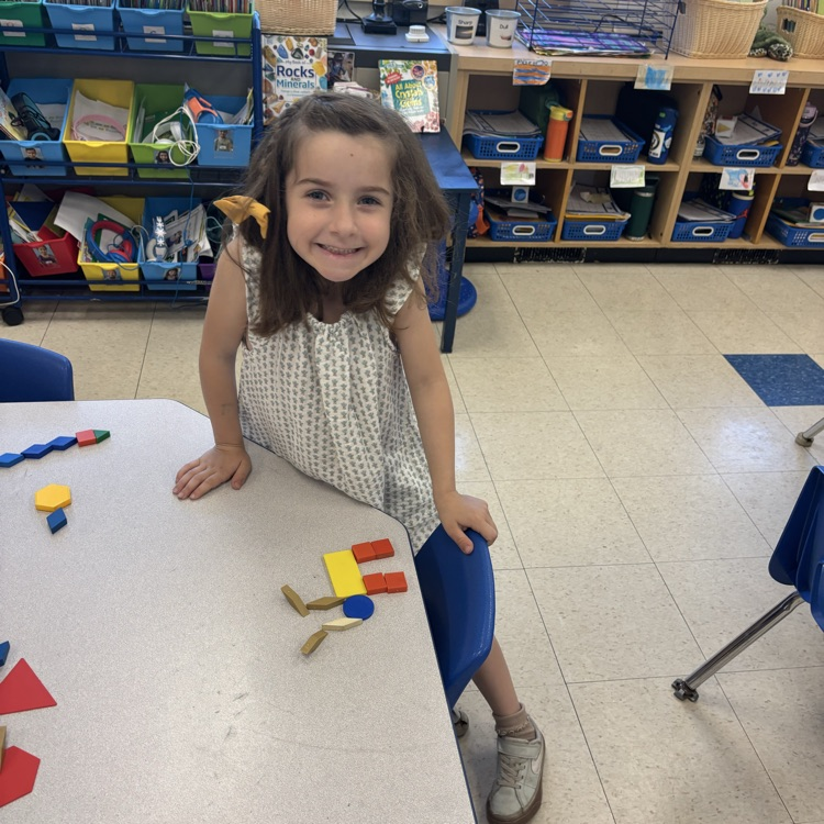 student making a picture with shape