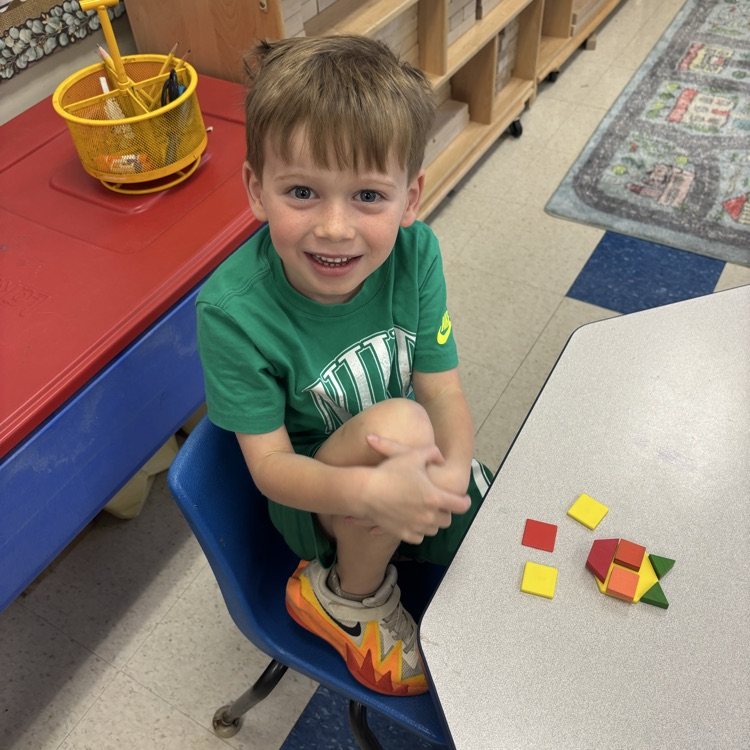 student making a picture with shape