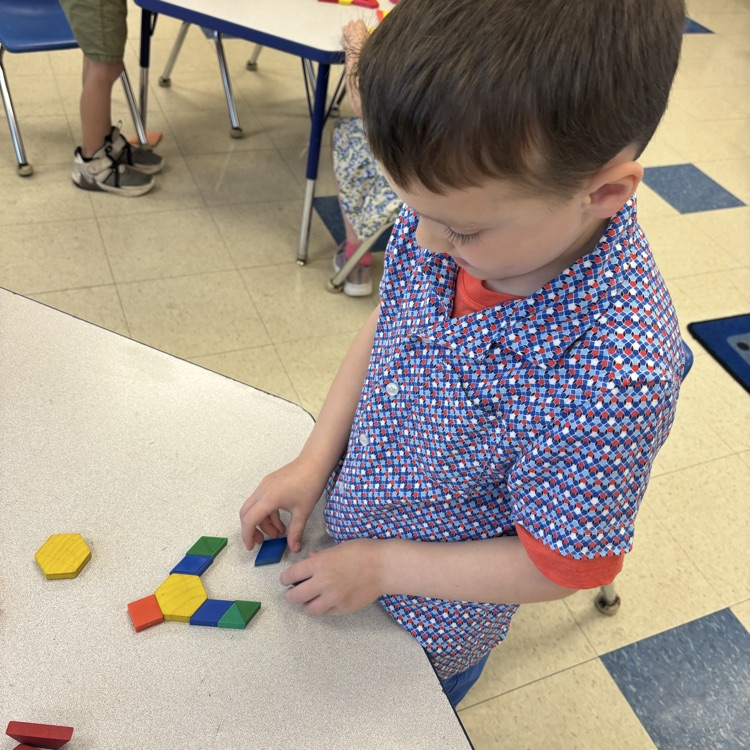 student making a picture with shape