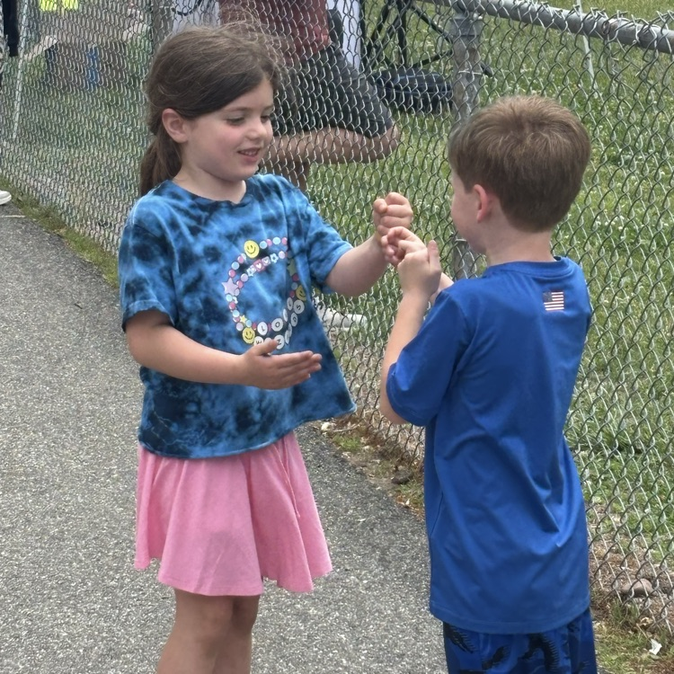 girl and boy playing rock paper scissors
