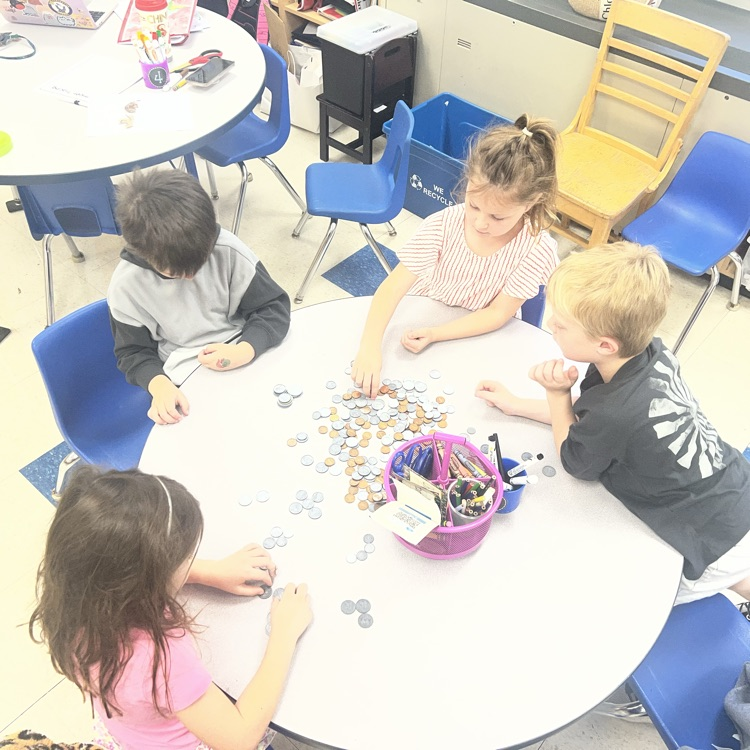 KRO sorts quarters, dimes, nickels and pennies in math