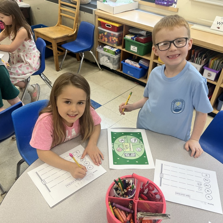 KRO plays money spin to practice learning coins and the $1 bill.