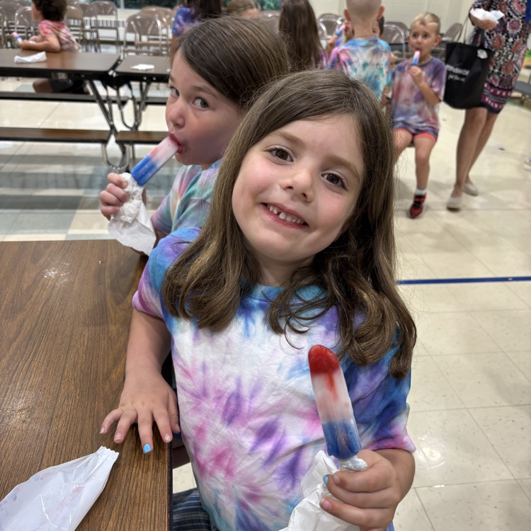 two little girls, eating ice pops
