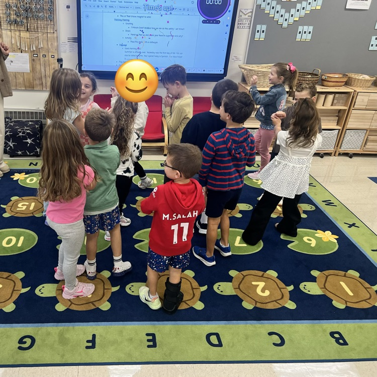 KR is doing a great job learning the routines during morning meeting. Today they enjoyed greeting as many classmates as they could in 1 minute and played pass the apple with clothespins for the activity.  