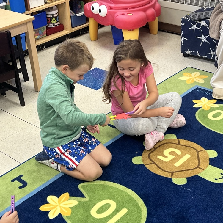 KR is doing a great job learning the routines during morning meeting. Today they enjoyed greeting as many classmates as they could in 1 minute and played pass the apple with clothespins for the activity.  