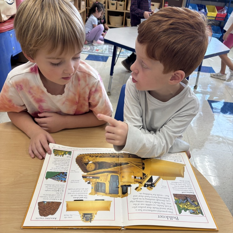 boys reading and talking together