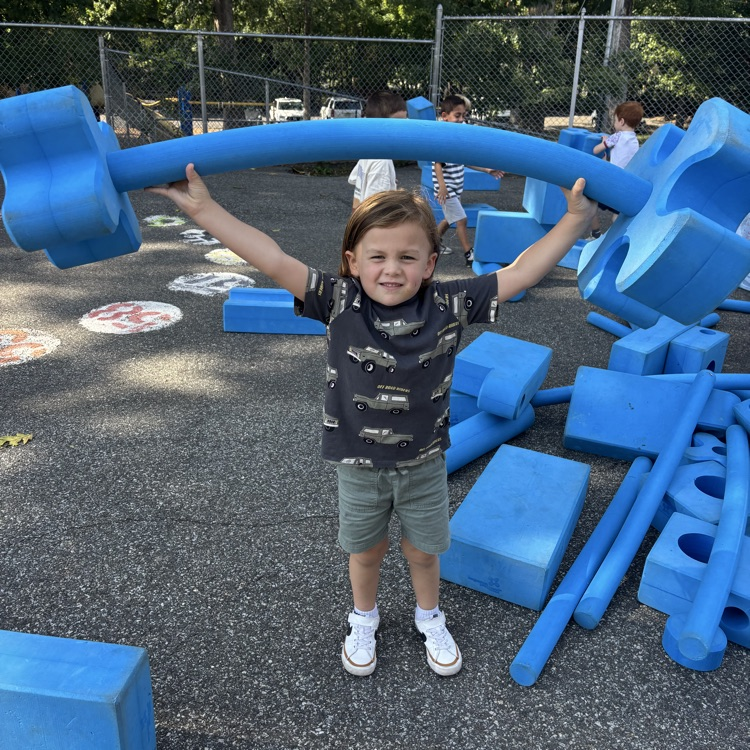 boy playing with block