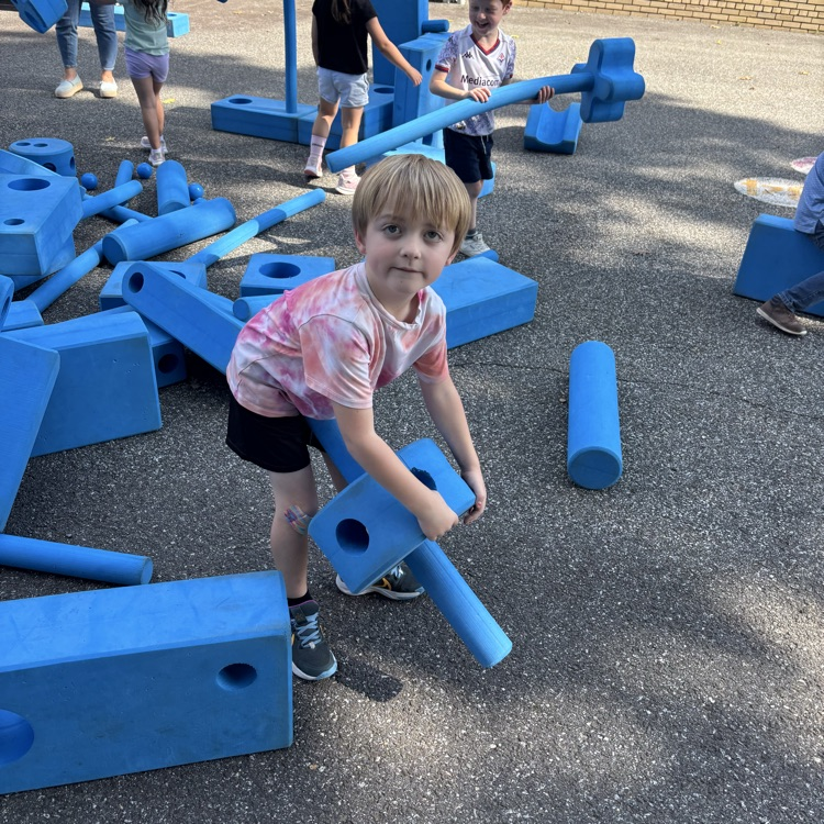 boy playing with block