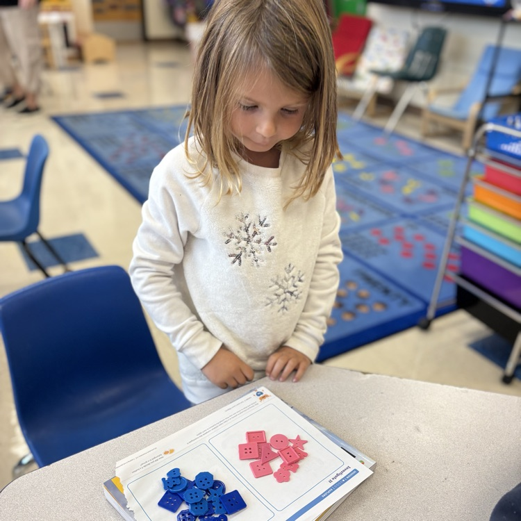 girl sorting buttons