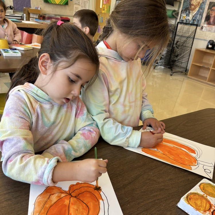 students painting, pumpkin