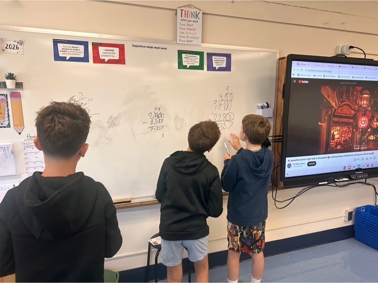 Students at whiteboard for math practice