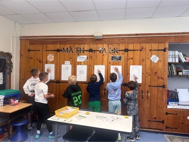 Students at whiteboard for math practice