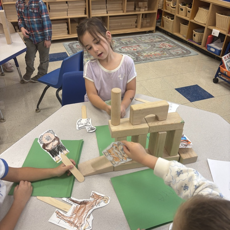 be telling the Billy goats gruff using blocks and pup