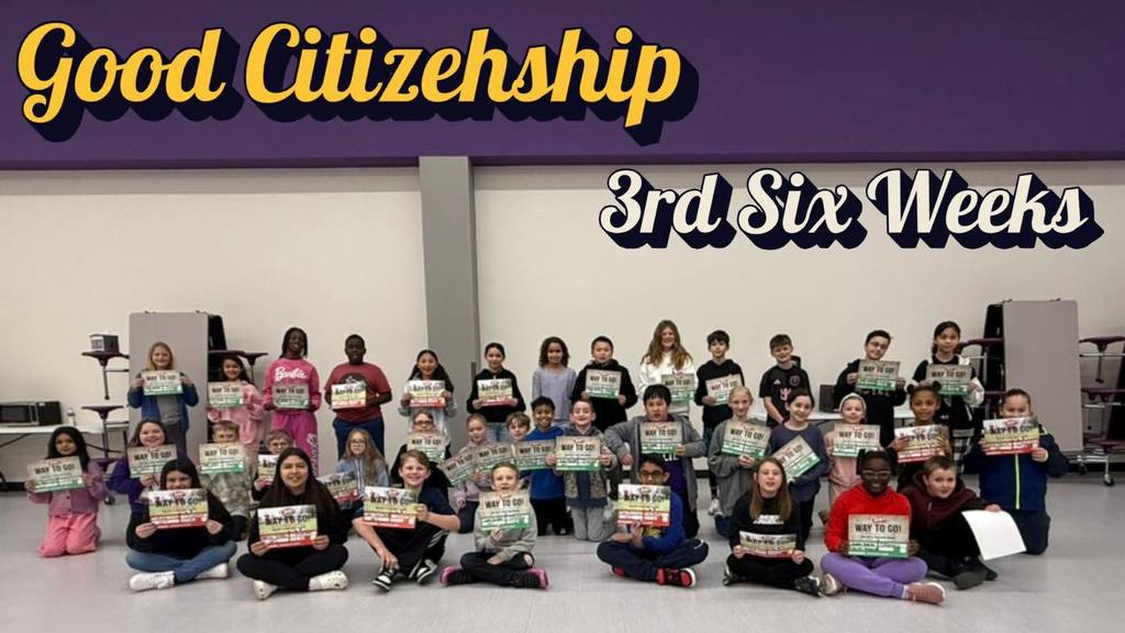 A group of students at Wylie Intermediate East hold certificates for 'Good Citizenship' during the 3rd six weeks, posing in a school cafeteria.