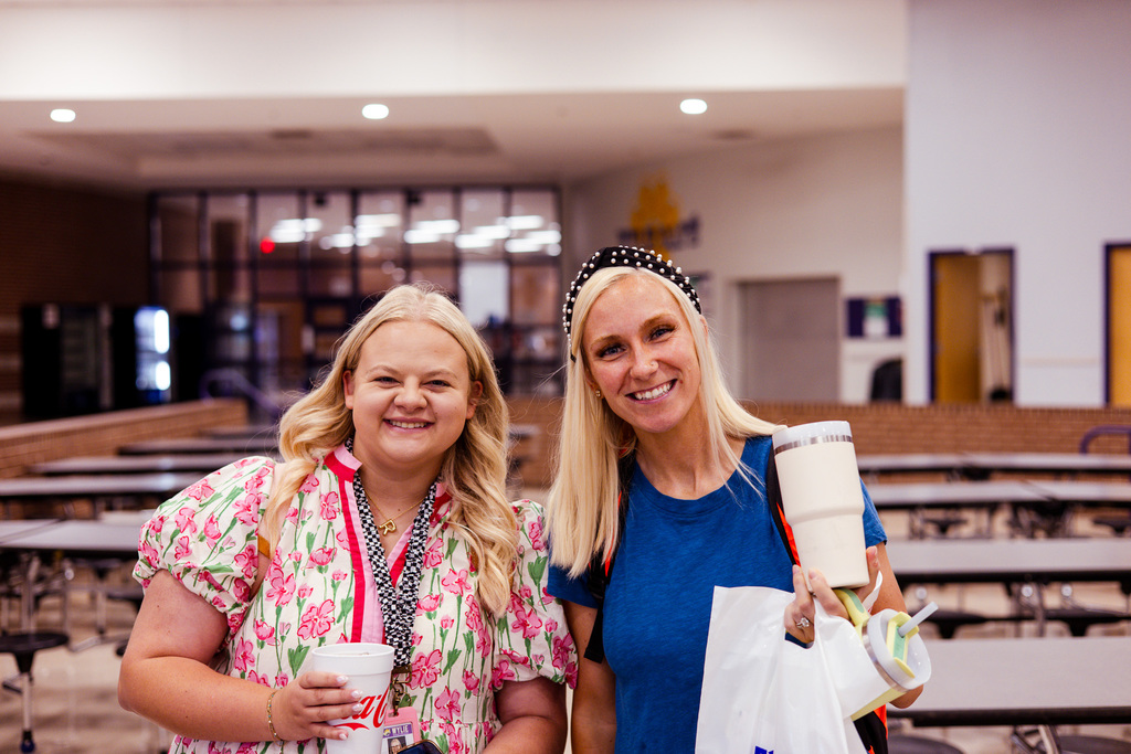 two teachers with sandwich bags