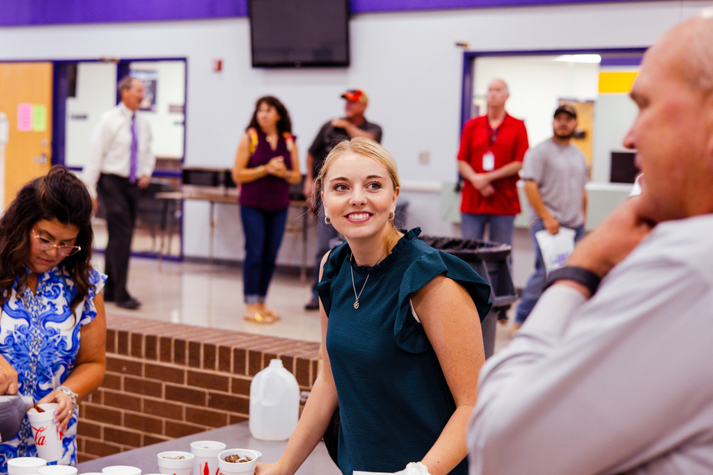 new teacher listening to principal