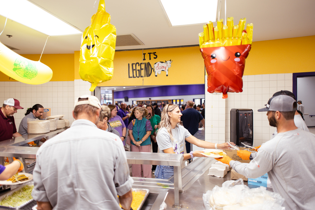 teacher being served in lunch line