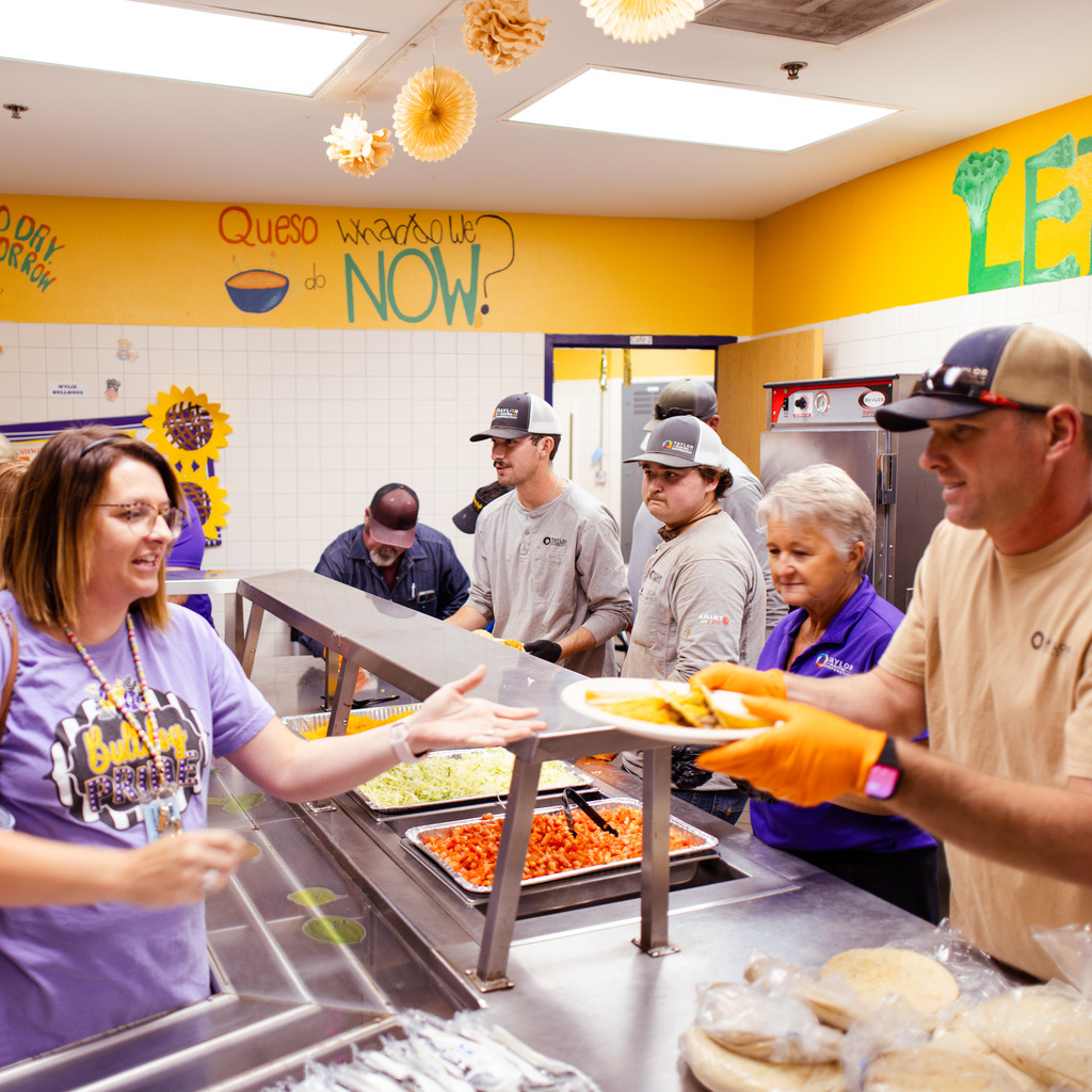 teacher being served in lunch line