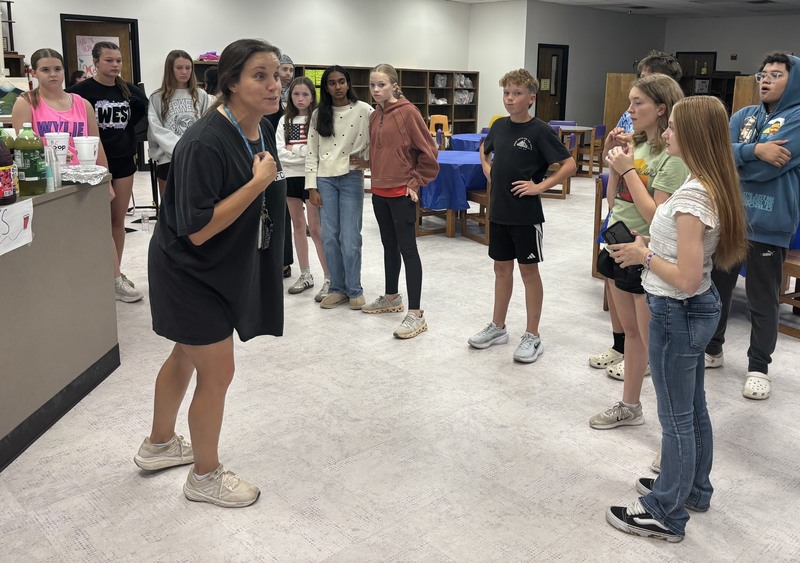 Seventh-grade advanced RLA teacher Ann Hurst gives final instructions before the medieval museum night.