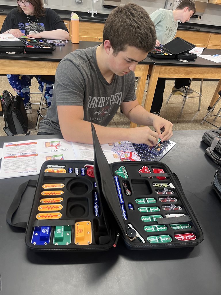 Physical science students build circuits.