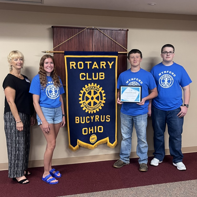 The Wynford Interact Club accepts Club Excellence award from Rotary District 6600 governor. 