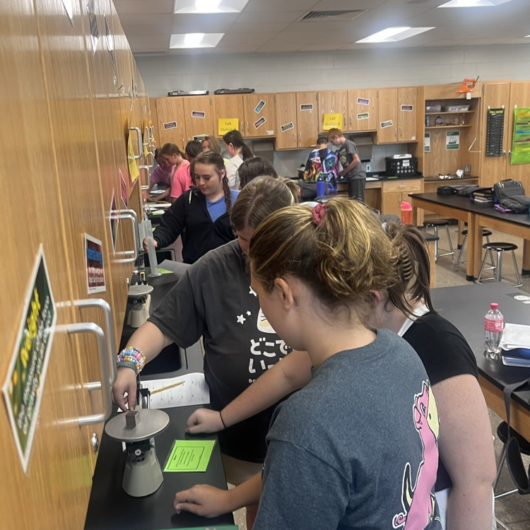 Physical science students perform their first lab of the year.