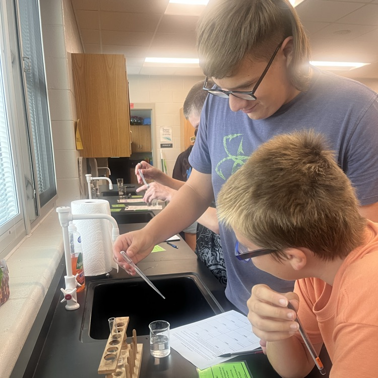 Physical science students perform their first lab of the year.